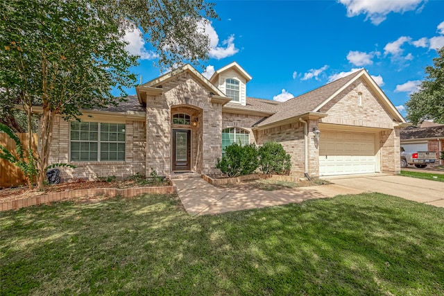 ranch-style home featuring a garage and a front lawn