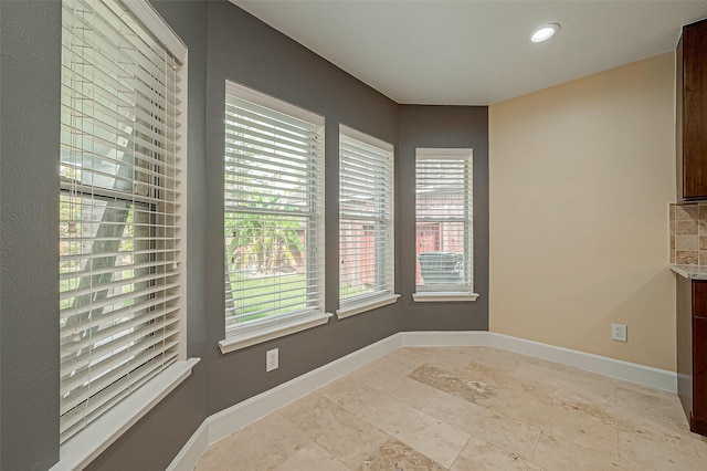 unfurnished dining area featuring a wealth of natural light