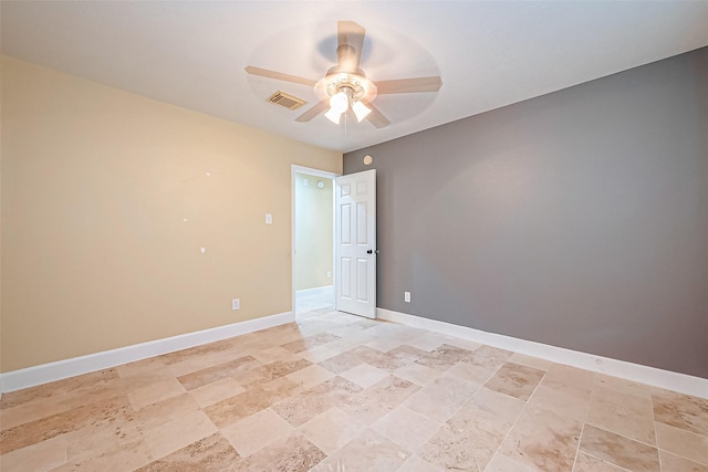 unfurnished room with ceiling fan