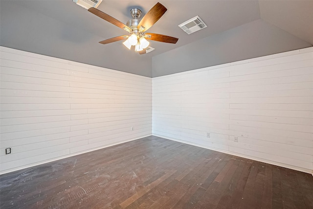 spare room featuring ceiling fan and dark wood-type flooring