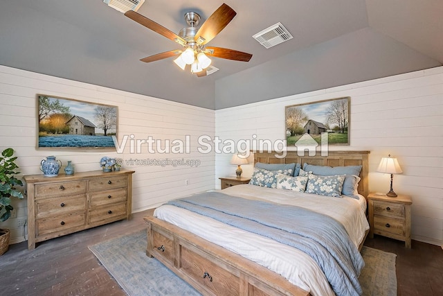 bedroom featuring ceiling fan, dark hardwood / wood-style floors, and vaulted ceiling