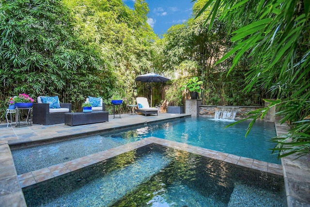 view of pool featuring a patio