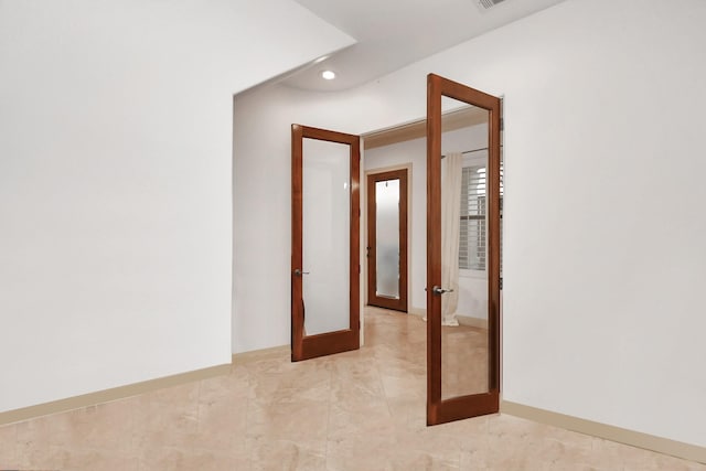 hallway with recessed lighting, french doors, and baseboards