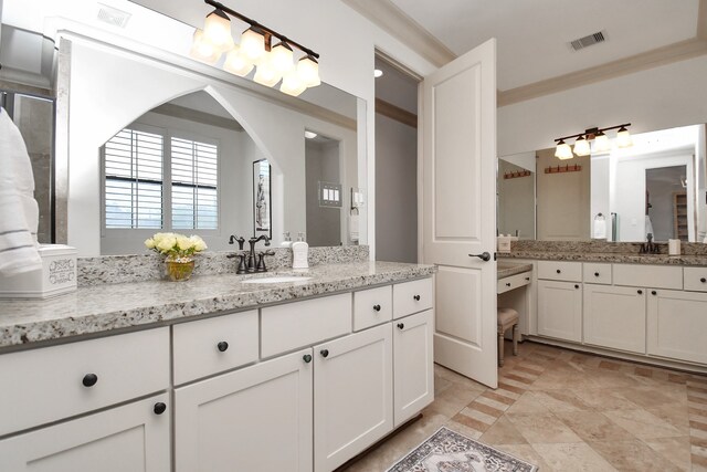 bathroom with vanity and crown molding