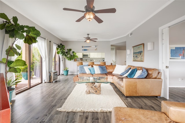 living room featuring ornamental molding, dark hardwood / wood-style floors, and ceiling fan