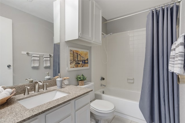 full bathroom featuring vanity, shower / bath combo with shower curtain, toilet, and tile patterned flooring