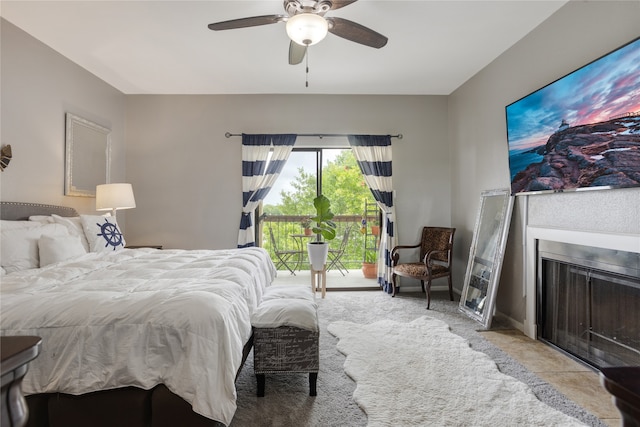 bedroom with light tile patterned floors and ceiling fan