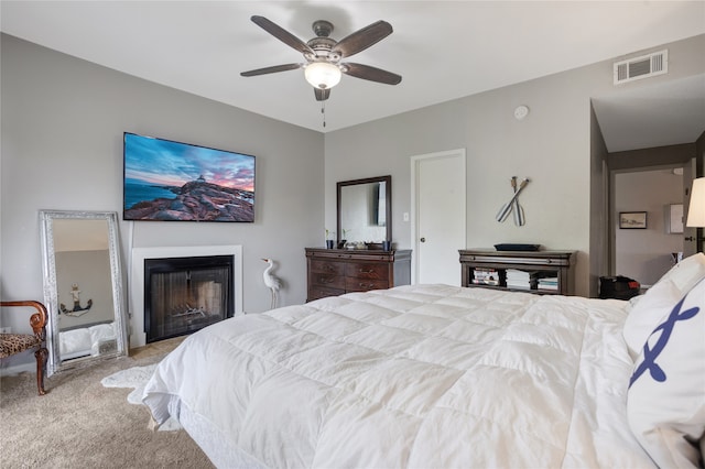 carpeted bedroom with ceiling fan