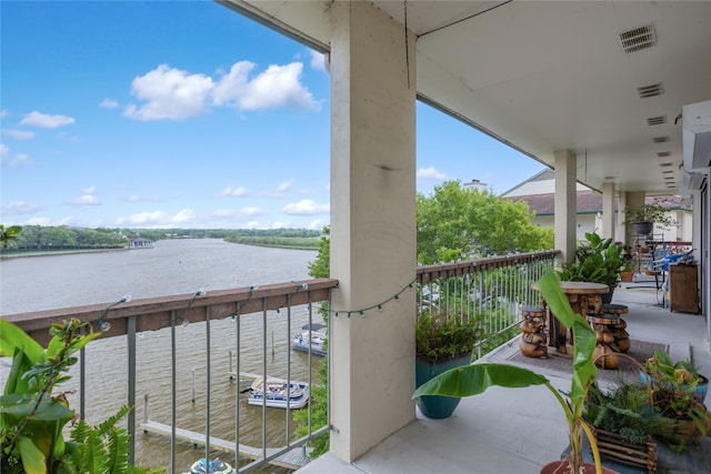 balcony featuring a water view