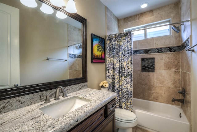 full bathroom featuring vanity, shower / bath combination with curtain, and toilet