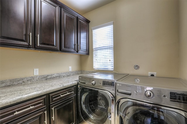 laundry room with cabinets and independent washer and dryer