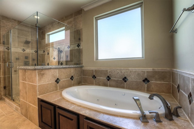 bathroom with separate shower and tub