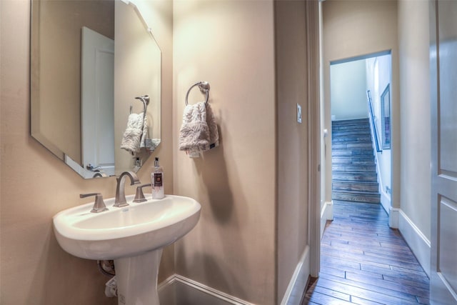 bathroom with hardwood / wood-style floors