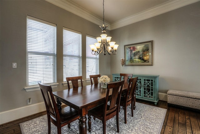 dining room with ornamental molding, an inviting chandelier, and dark wood-type flooring