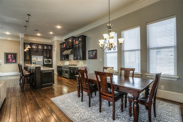 dining space with a chandelier, dark hardwood / wood-style flooring, plenty of natural light, and ornamental molding