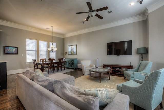 living room featuring ceiling fan with notable chandelier, dark hardwood / wood-style flooring, and ornamental molding