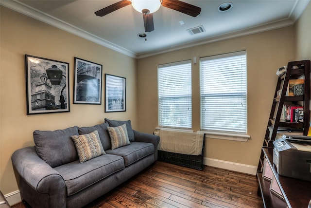 living room with ceiling fan, crown molding, and dark wood-type flooring