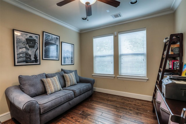 living room featuring ornamental molding, ceiling fan, and dark wood-type flooring