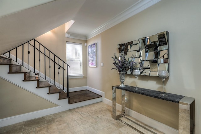 foyer entrance featuring ornamental molding