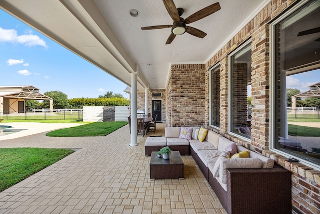 view of patio / terrace featuring an outdoor living space and ceiling fan