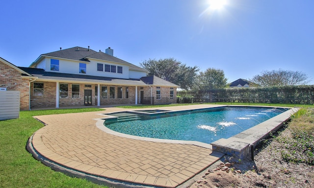 view of pool with an in ground hot tub and a patio