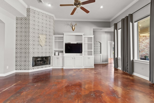 unfurnished living room with a fireplace, ceiling fan, and ornamental molding