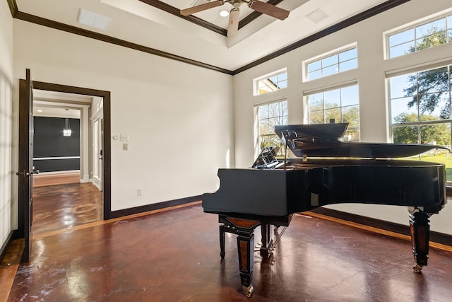 miscellaneous room with crown molding, a towering ceiling, and ceiling fan