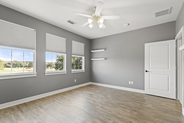 spare room featuring ceiling fan and wood-type flooring