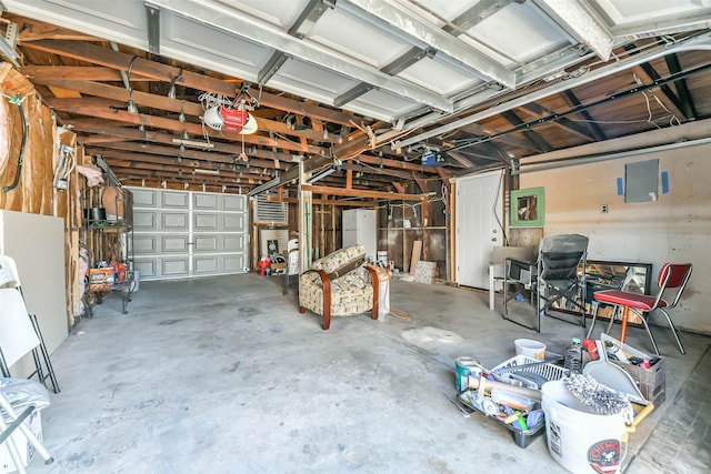 garage with a garage door opener and white fridge