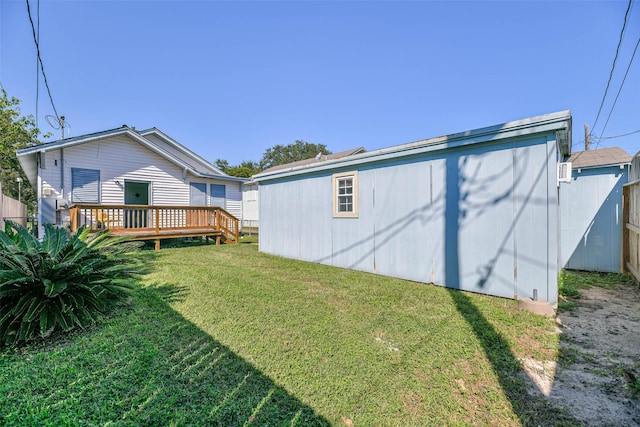 view of yard featuring a wooden deck and fence