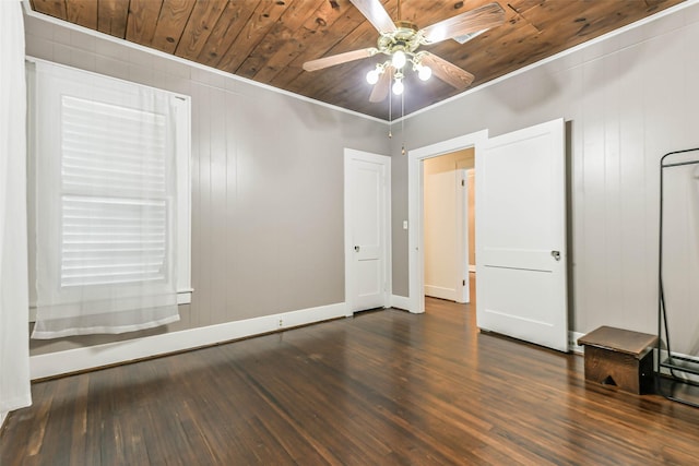 unfurnished room with wood ceiling, baseboards, a ceiling fan, and wood finished floors