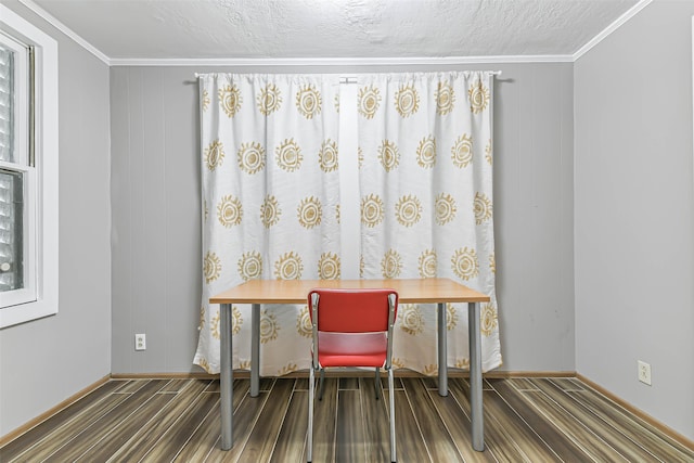 office space featuring ornamental molding, wood-type flooring, and a textured ceiling