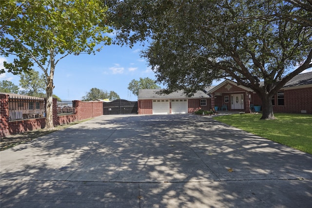 ranch-style house with a garage and a front yard