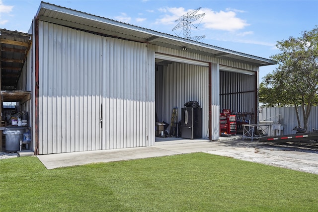 view of outbuilding with a lawn