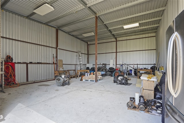 garage featuring stainless steel fridge