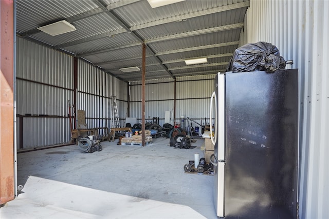 garage featuring stainless steel fridge