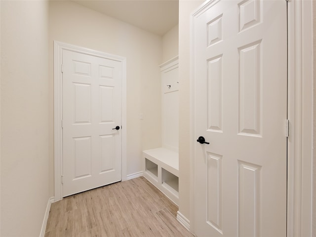 mudroom with light hardwood / wood-style flooring