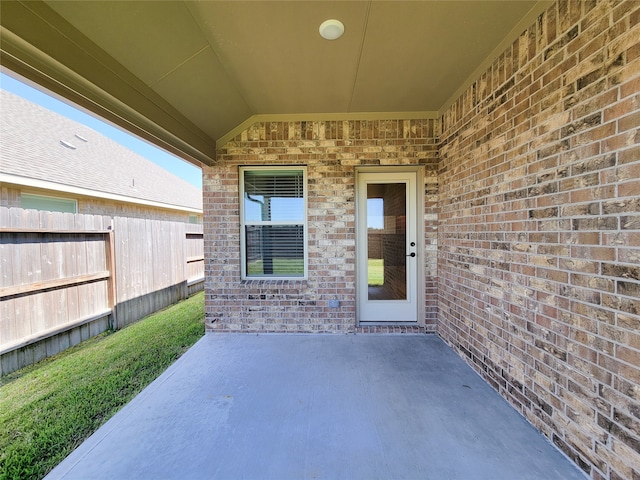 property entrance featuring a patio