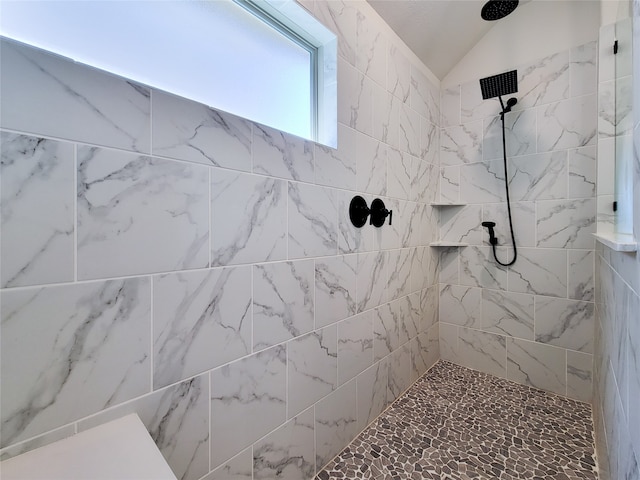 bathroom featuring tiled shower