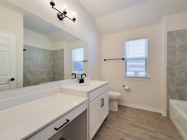 full bathroom with lofted ceiling, toilet, and a wealth of natural light