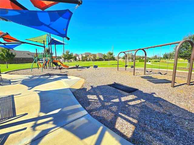 view of playground with a lawn