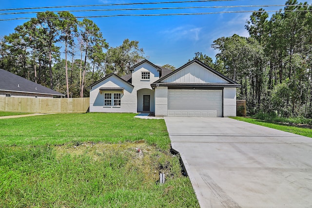 view of front of property featuring a front lawn and a garage