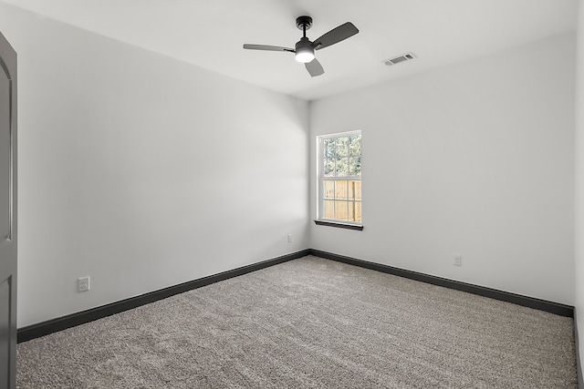 empty room featuring carpet and ceiling fan