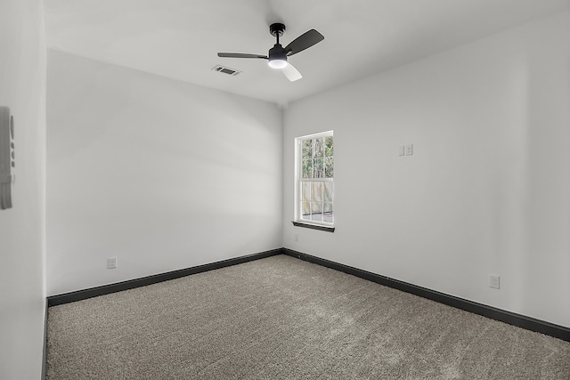 spare room with carpet flooring and ceiling fan