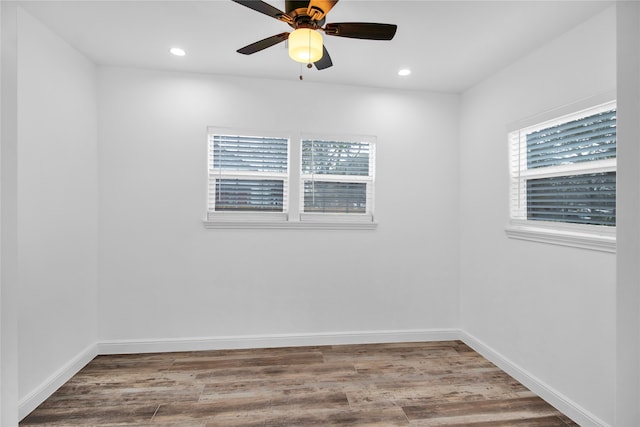 unfurnished room with ceiling fan and hardwood / wood-style flooring