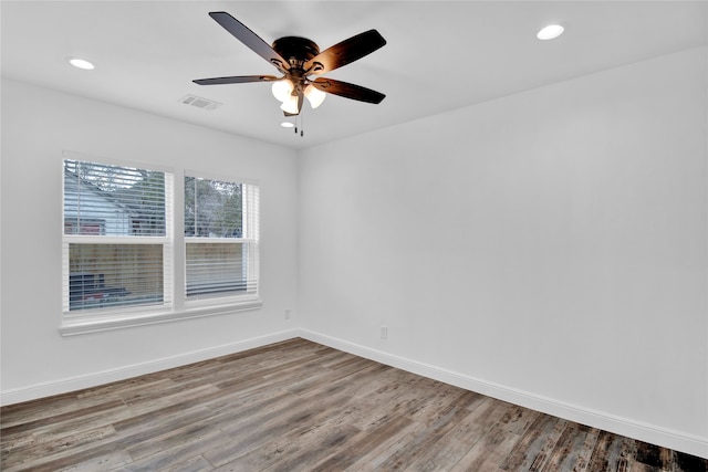 spare room featuring ceiling fan and hardwood / wood-style floors