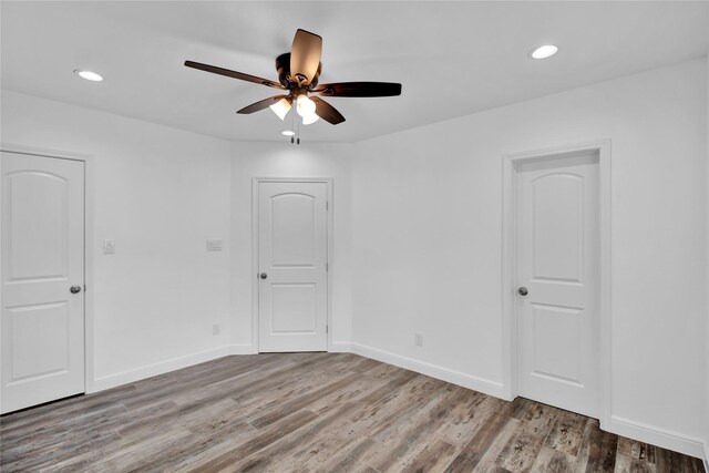 1307 Brooks Ave, Rosenberg, TX 77471 - spare room featuring a ceiling fan, wood finished floors, recessed lighting, and baseboards