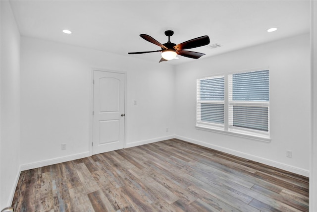 1307 Brooks Ave, Rosenberg, TX 77471 - unfurnished room featuring ceiling fan, wood finished floors, baseboards, and recessed lighting