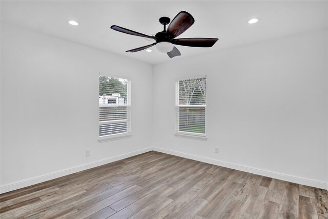 1307 Brooks Ave, Rosenberg, TX 77471 - empty room with wood finished floors, recessed lighting, ceiling fan, and baseboards