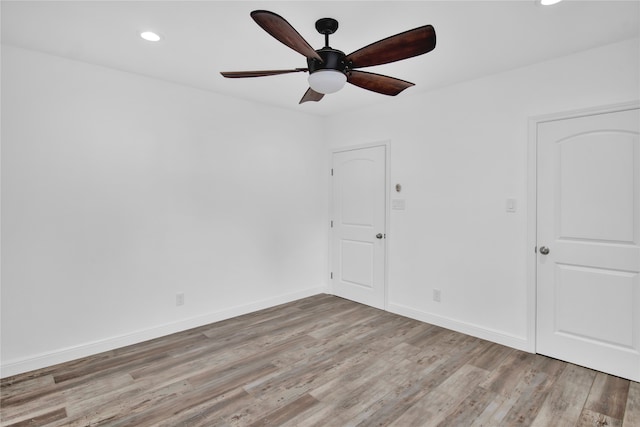 unfurnished room featuring light hardwood / wood-style flooring and ceiling fan